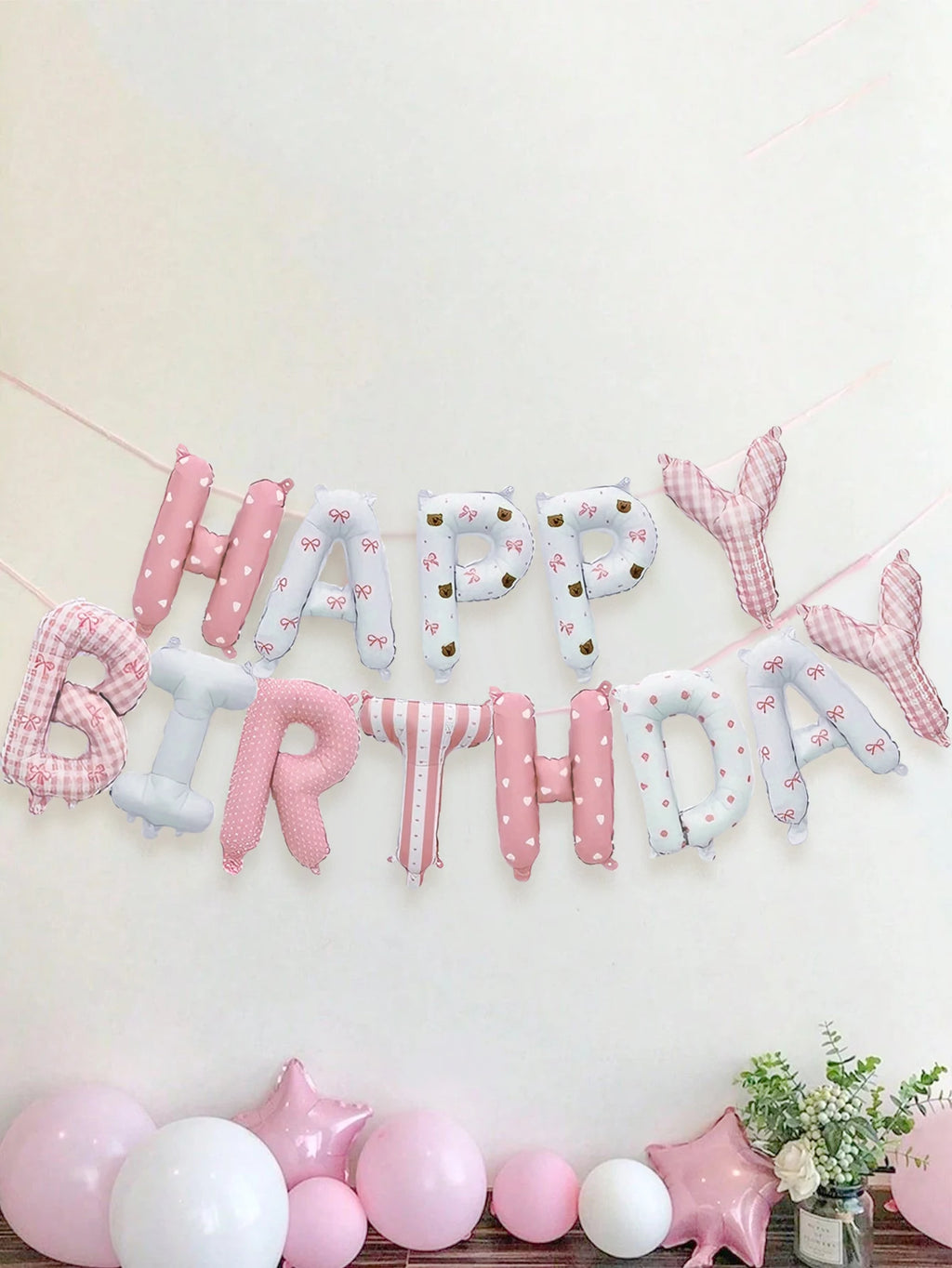 28-piece pink floral birthday set includes a floral "Happy Birthday" banner, pink latex balloons, and is suitable for birthday